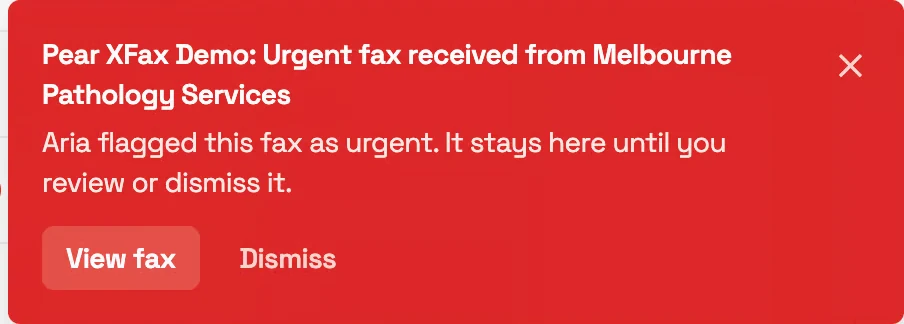 The red urgent-fax alert that appears on every screen until actioned